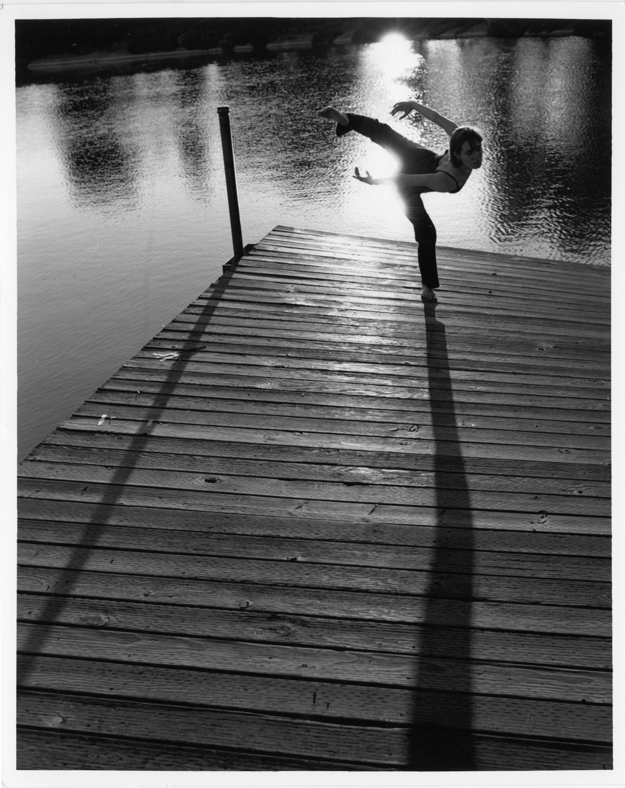 dancer posing on a pier
