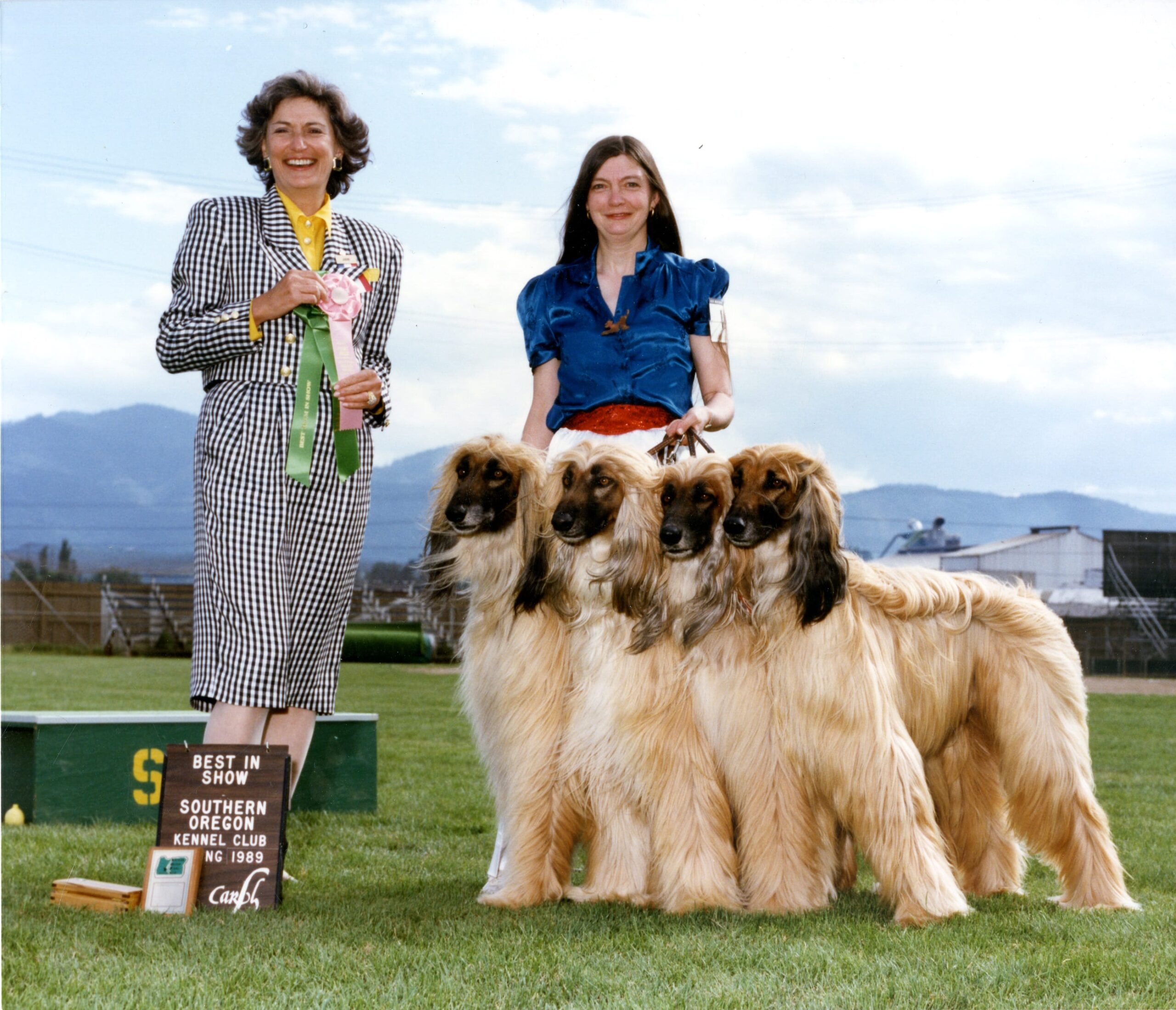 Sheila Grant and her four Afghan hounds are awarded Best in Show at the Southern Oregon Kennel Club dog show in 1989