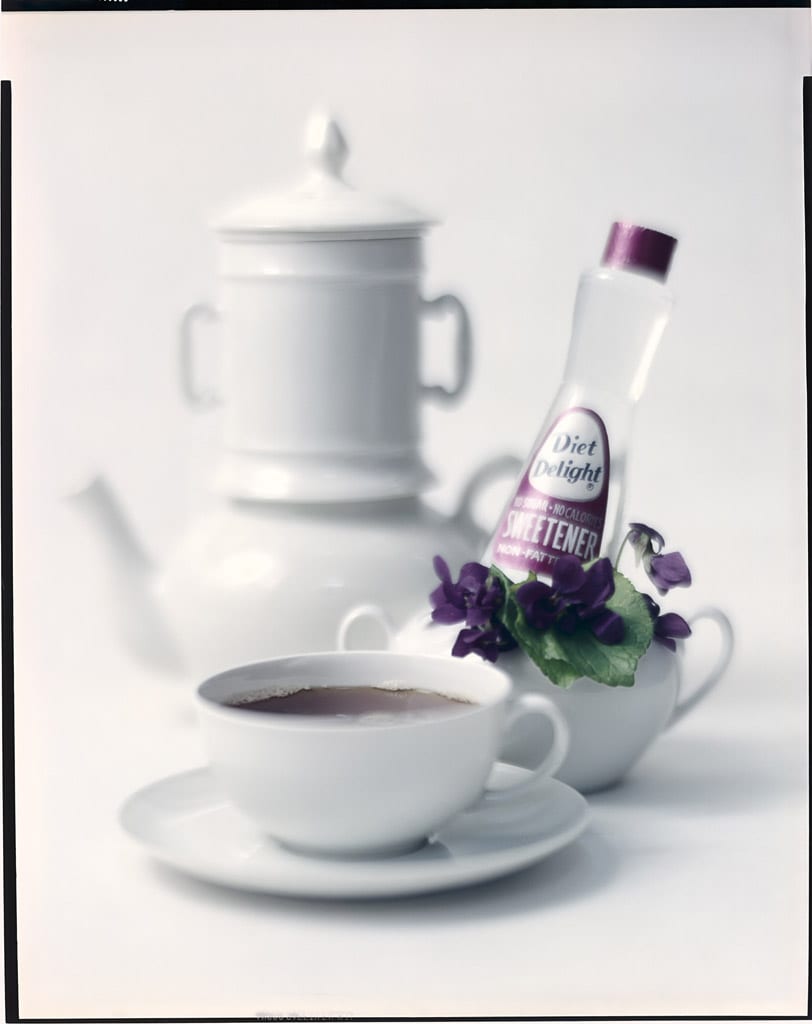 Diet Delight sweetener with white porcelain coffee cup and coffee pot, undated.