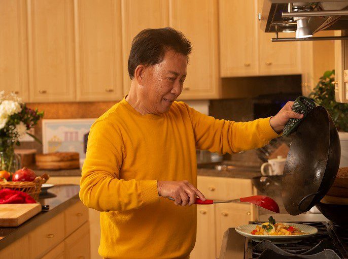Martin Yan serves a colorful stir fry from his first wok