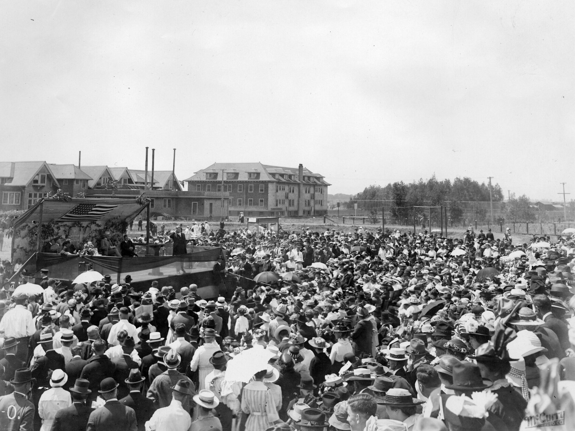 Large crowd of people in front of an outdoor  stage