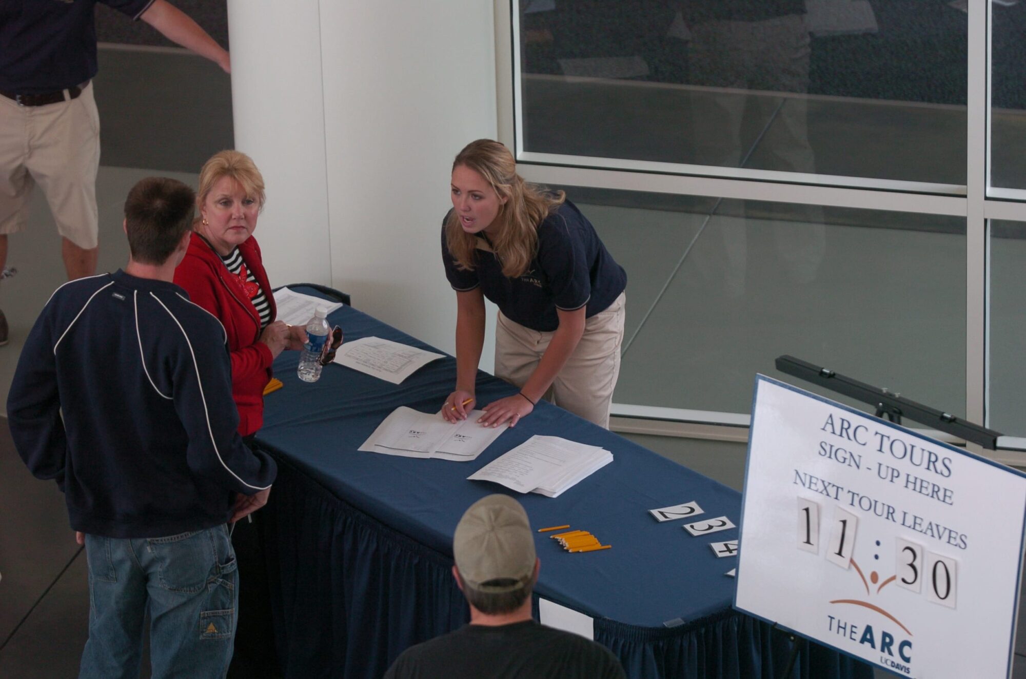 ARC tour sign up table with sign indicating time for next departure