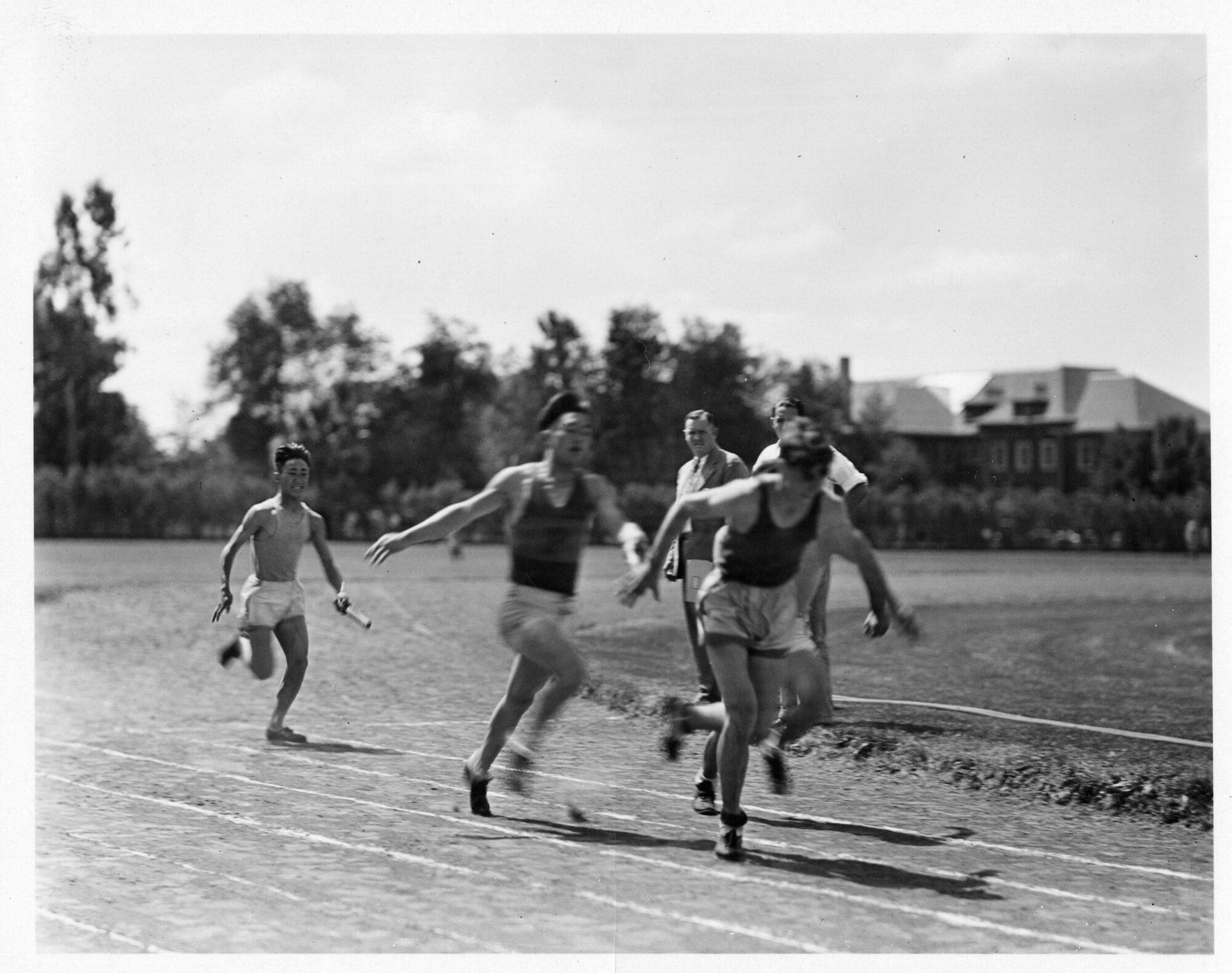 Three men running on a tack