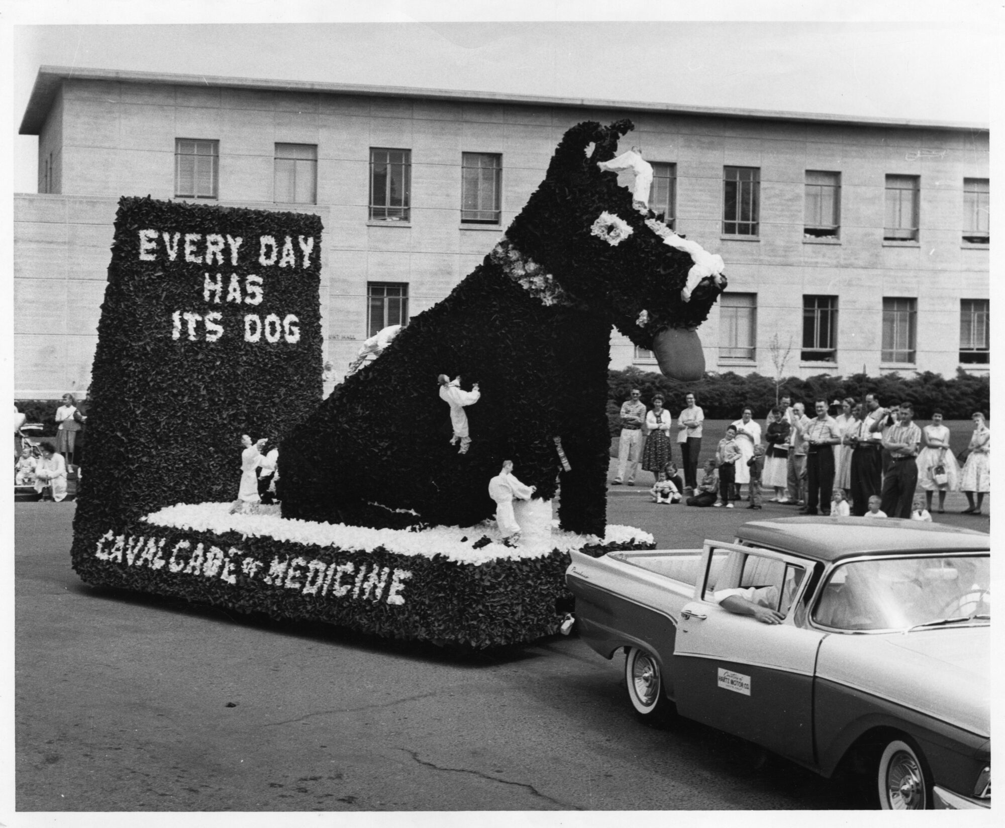 A float of a large dog in front of the words "Every dog has its day"
