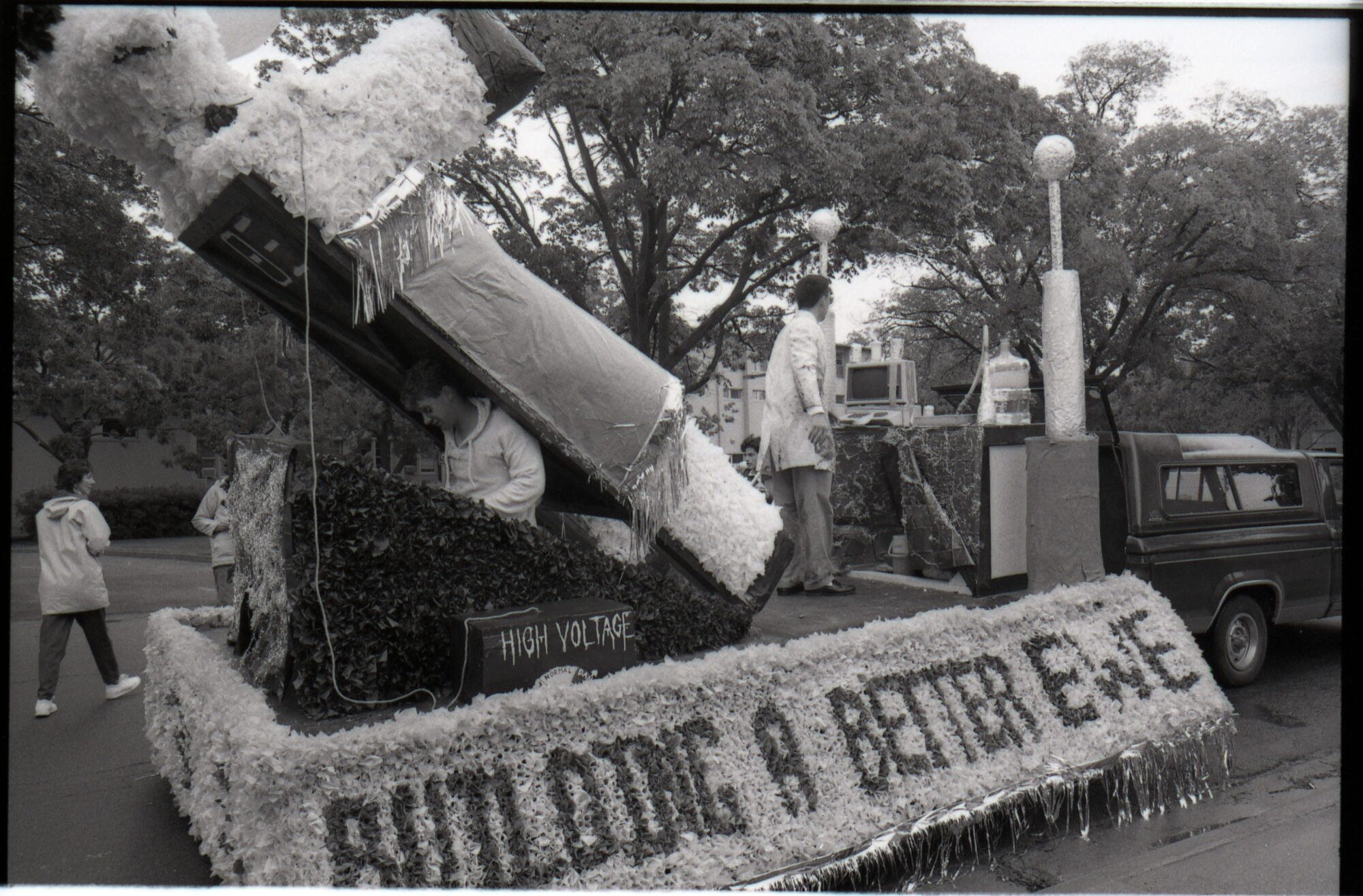 Float with giant papier-mâché sheep hooked up to a science station