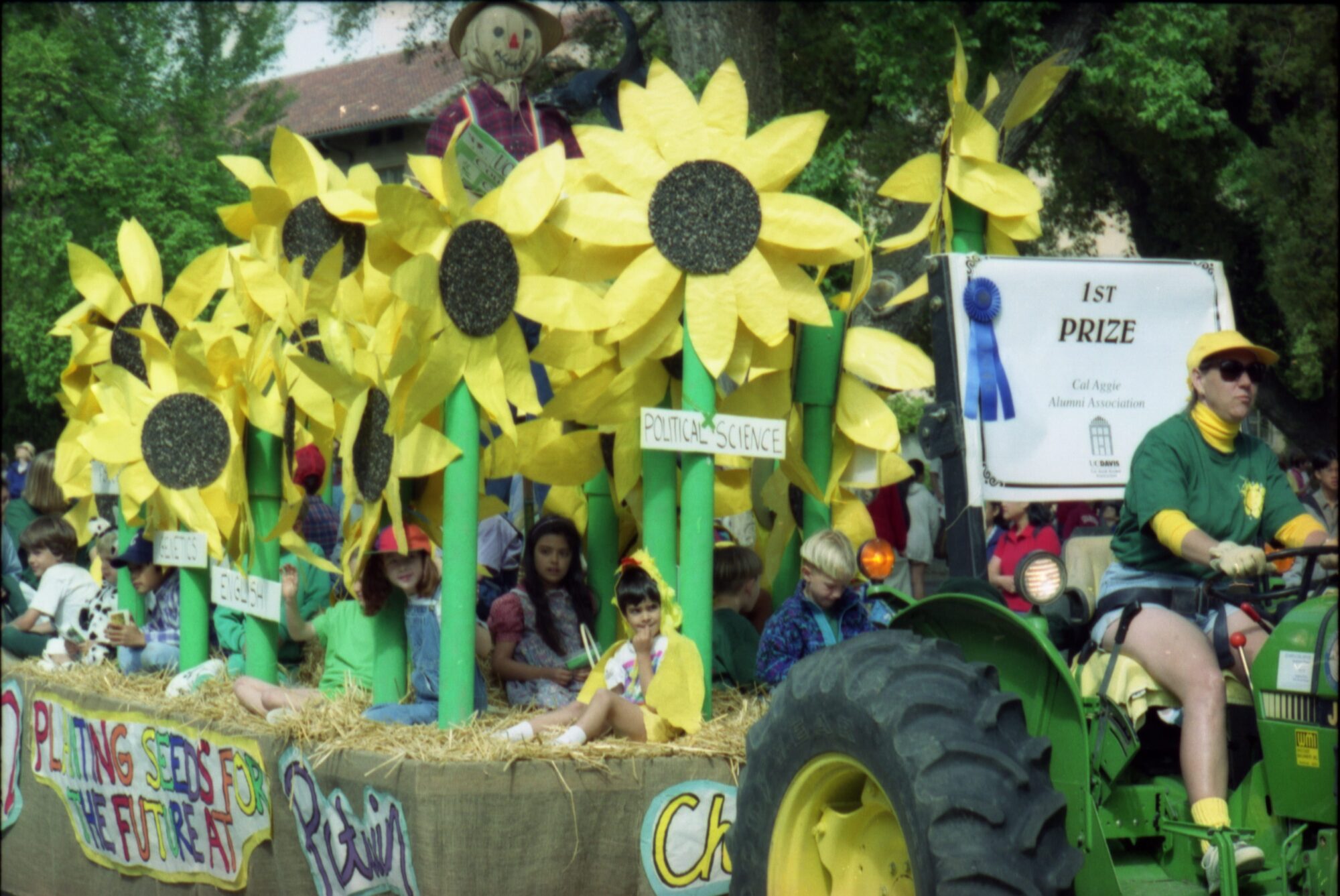 Children on a float with giant paper sunflowers and a first prize ribbon