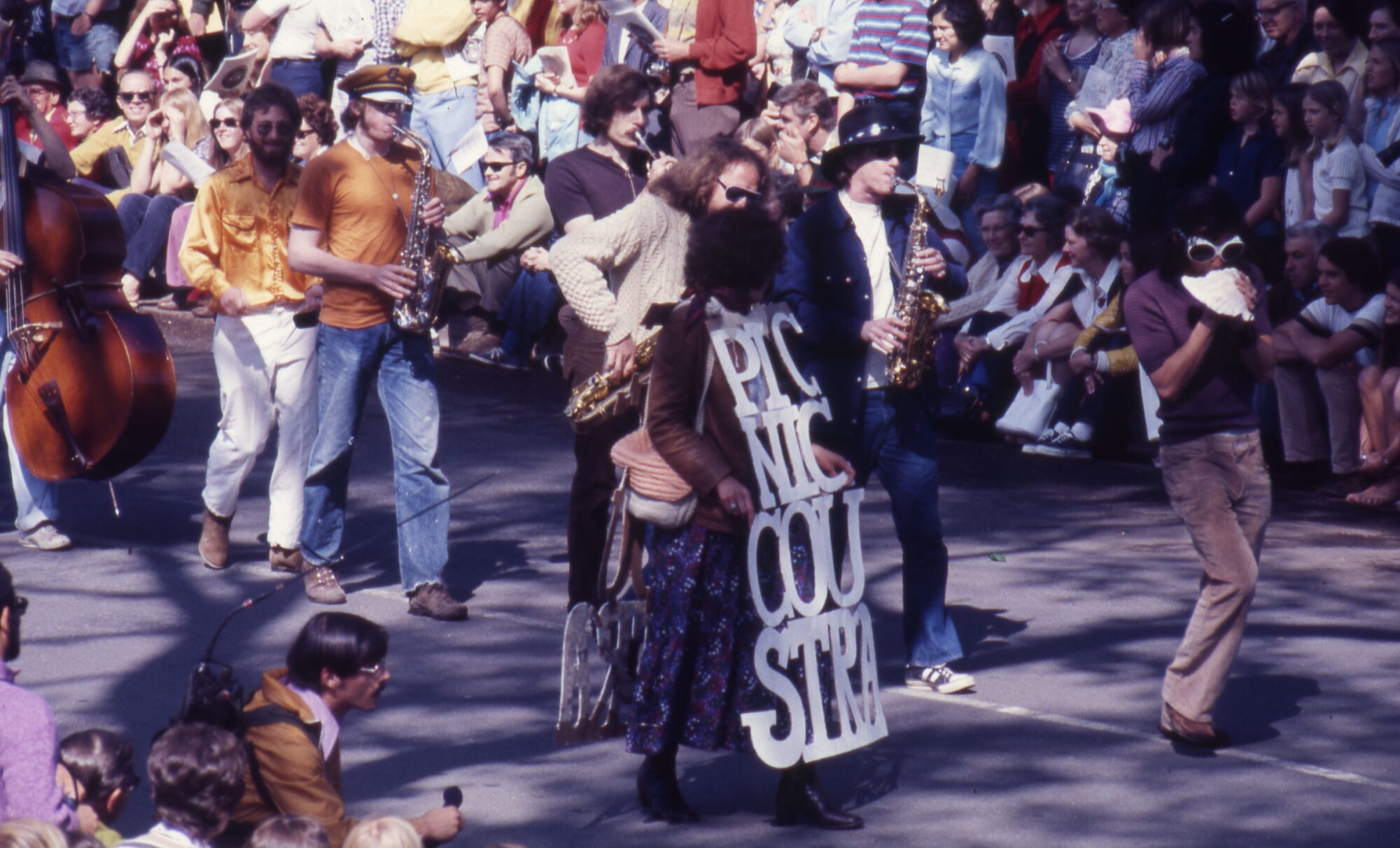 People in casual attired paying instruments