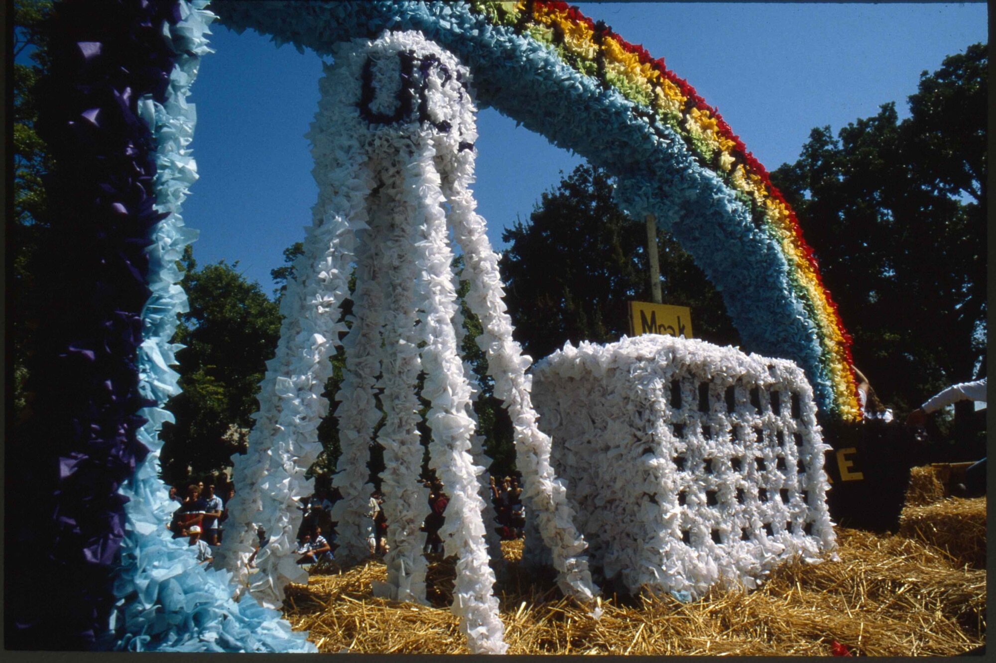 Picnic Day float depicting the water tower, Mrak Hall, and a rainbow made out of tissue. 