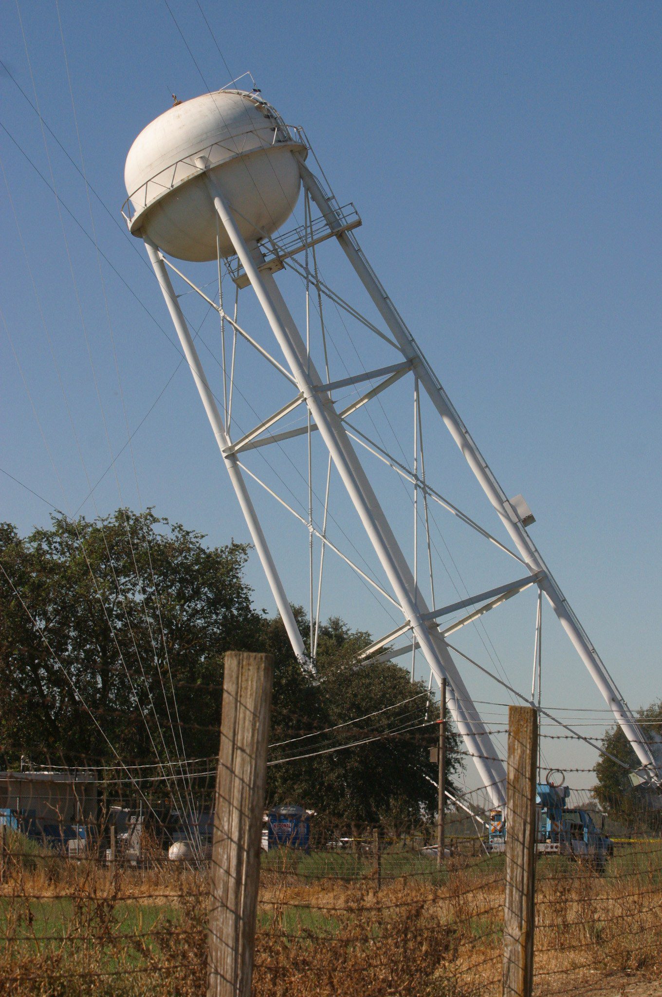Water tower cables attached being pulled down