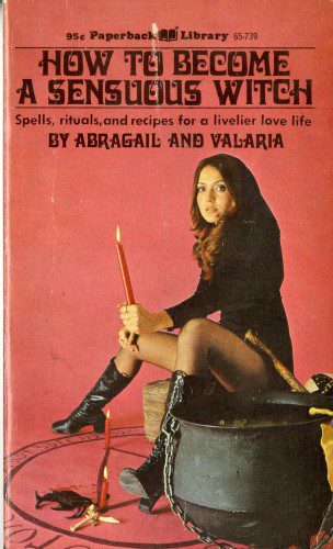 woman in black sitting on cauldron