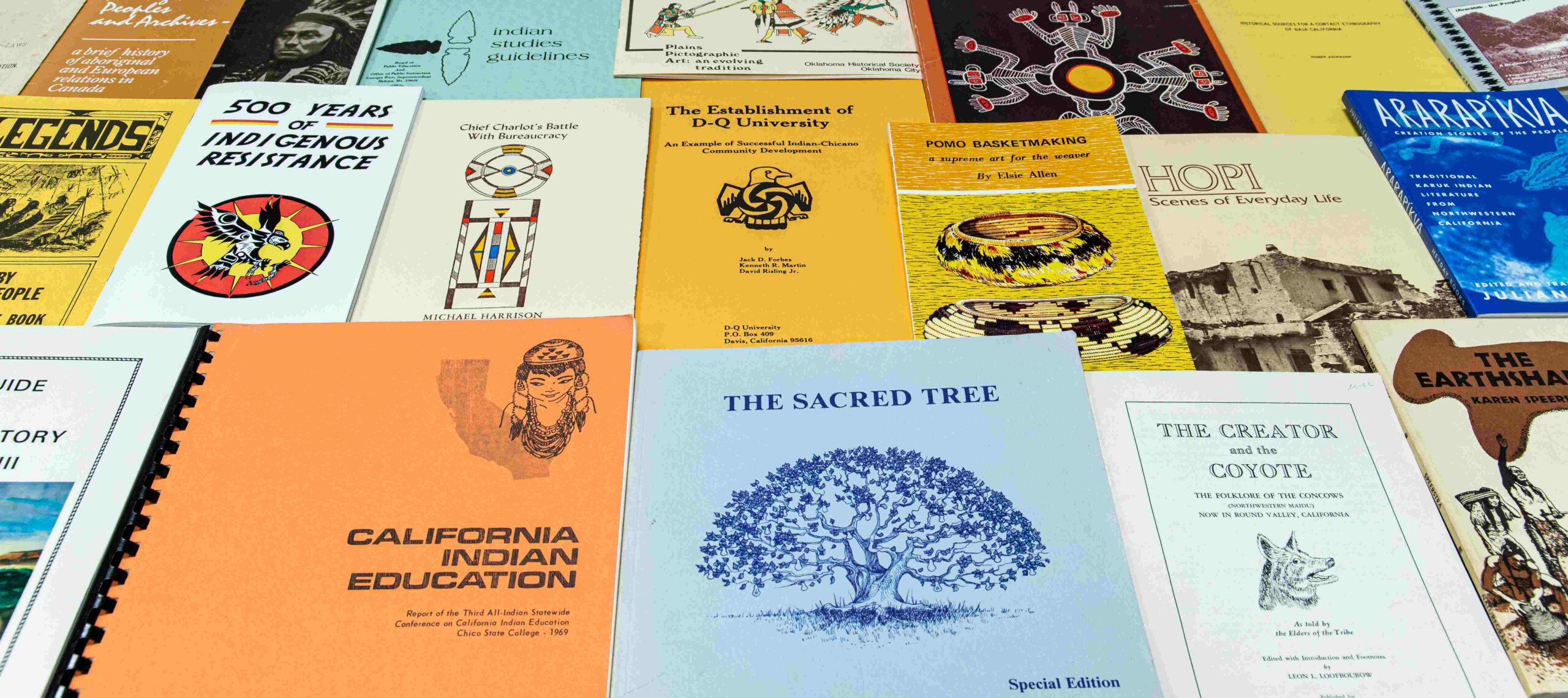 A collage of pamphlets of various colors and sizes with topics related to Native American history and culture.