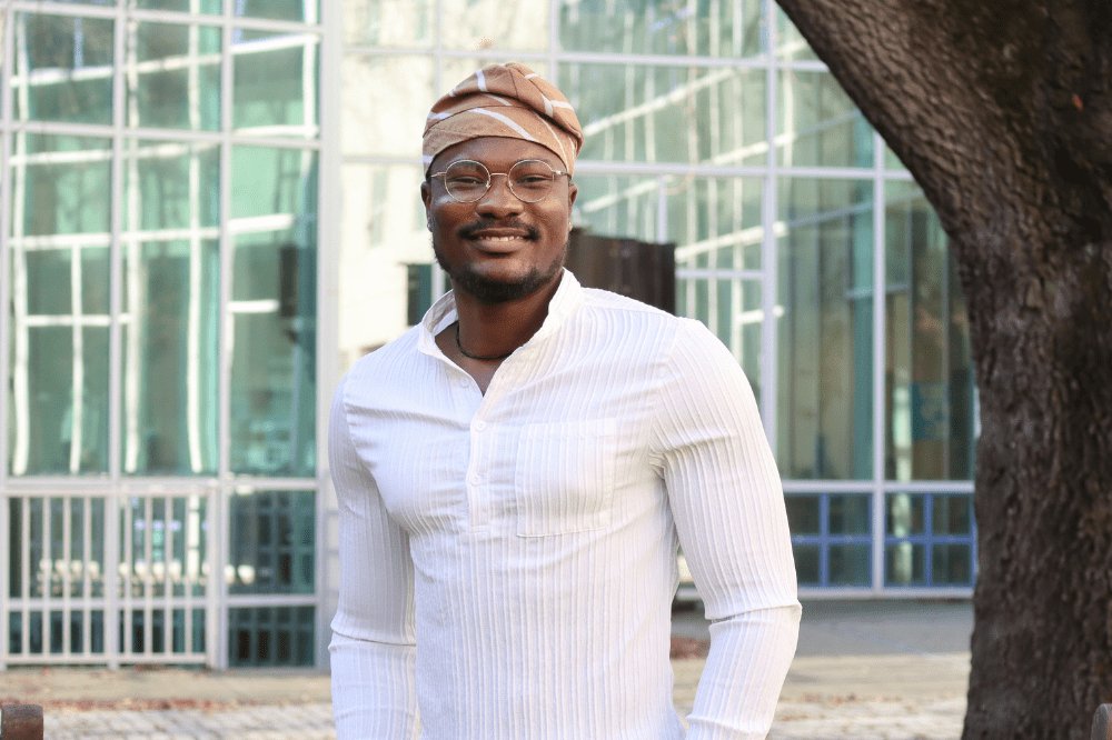 Portrait of grad prize winner Ibrahim Anoba in Shields Library Courtyard