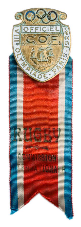Official credential badge from the 1924 Paris Olympics marked "Officiel, COF, VIII Olympiade" with a tricolor ribbon reading "Rugby Commission Nationale