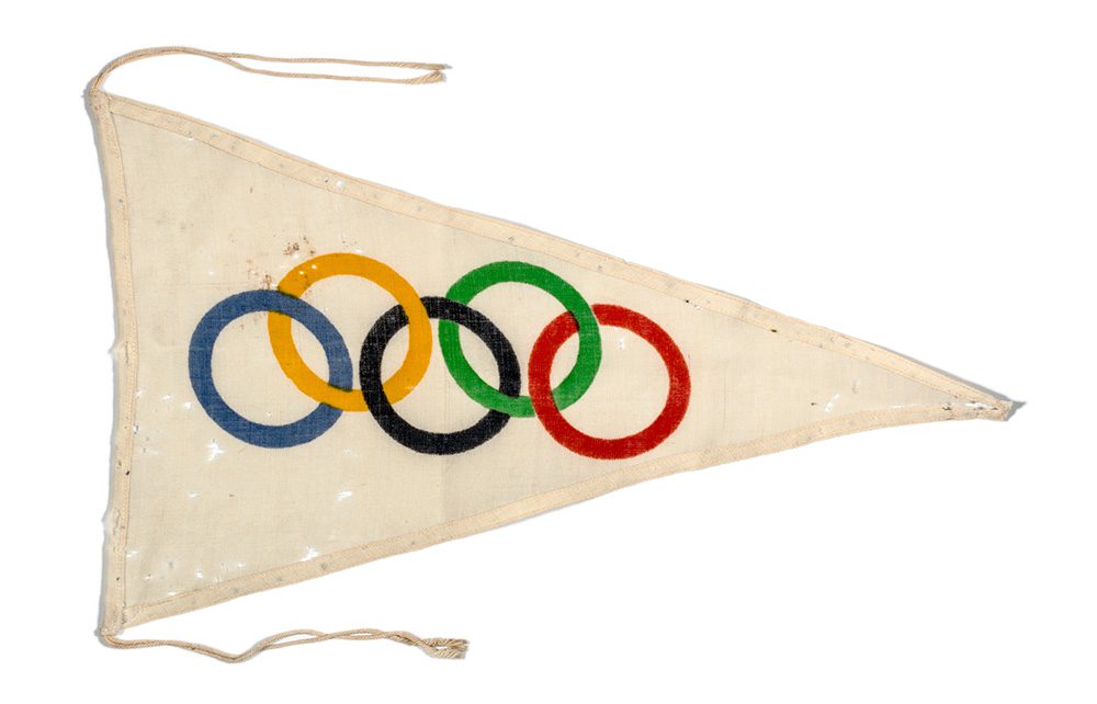 A triangular flag with the Olympic rings depicted.
