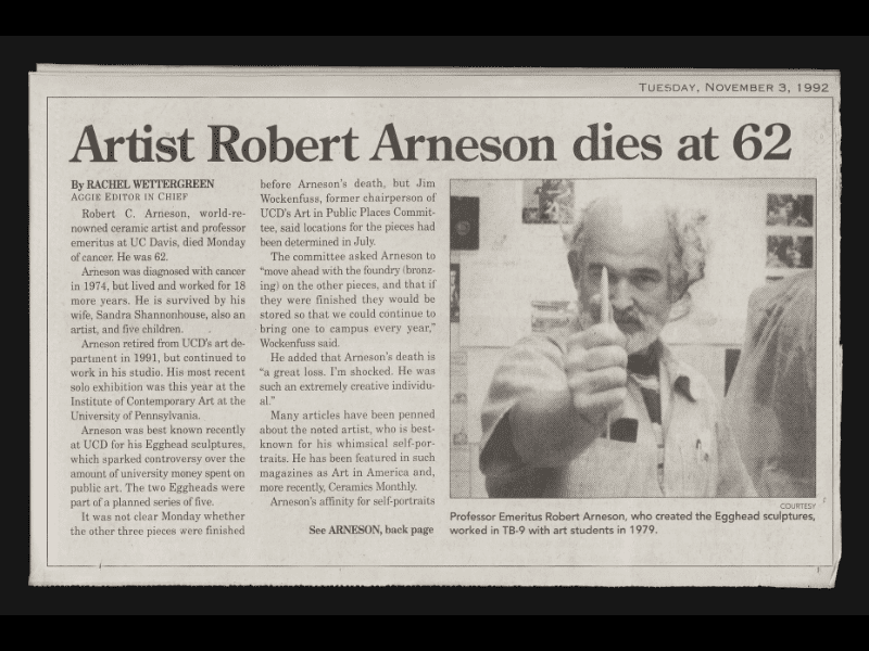 Newspaper clipping including a photo of Robert Arneson with one hand outstretched toward the camera