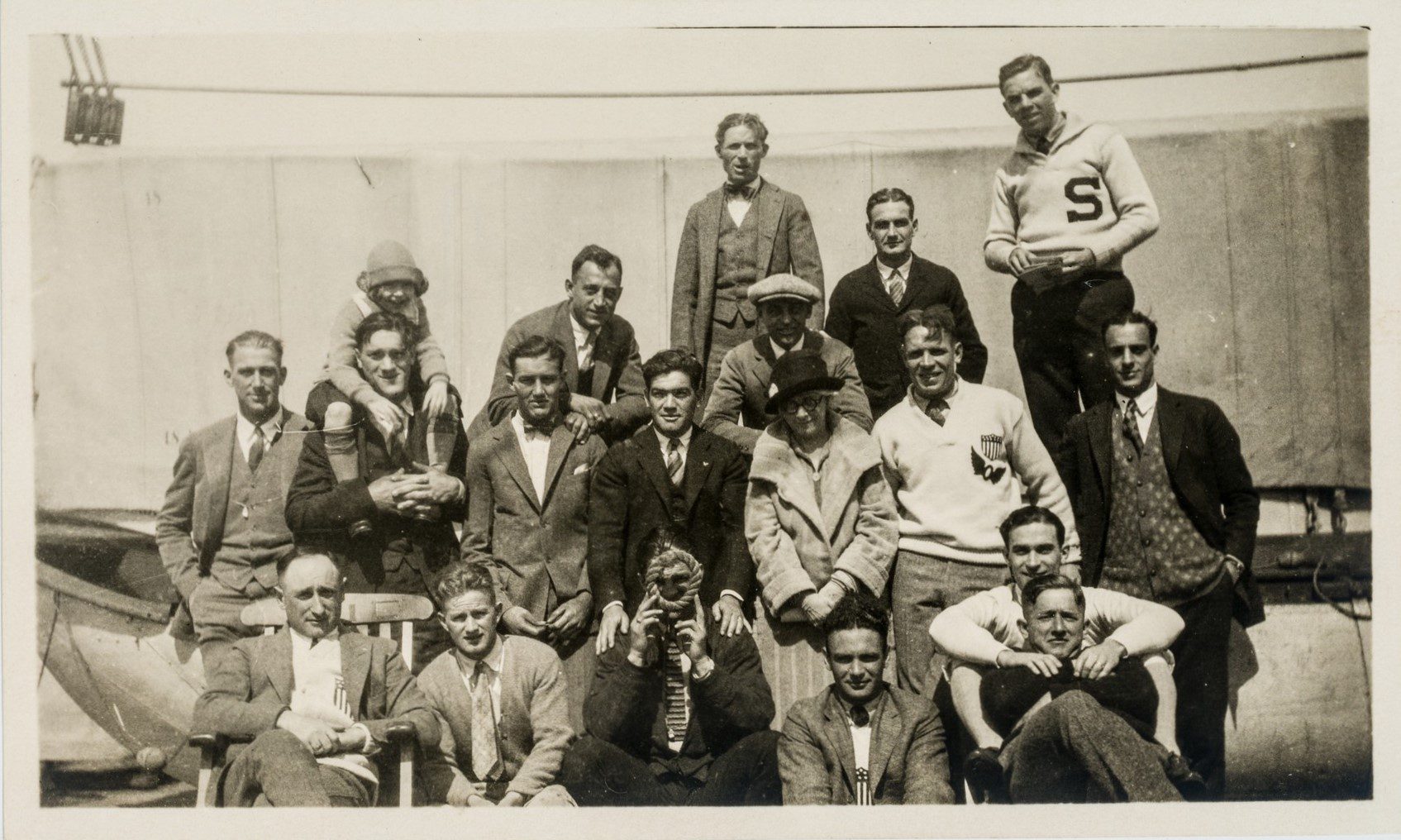 A black and white photograph of a group of men standing or sitting together.