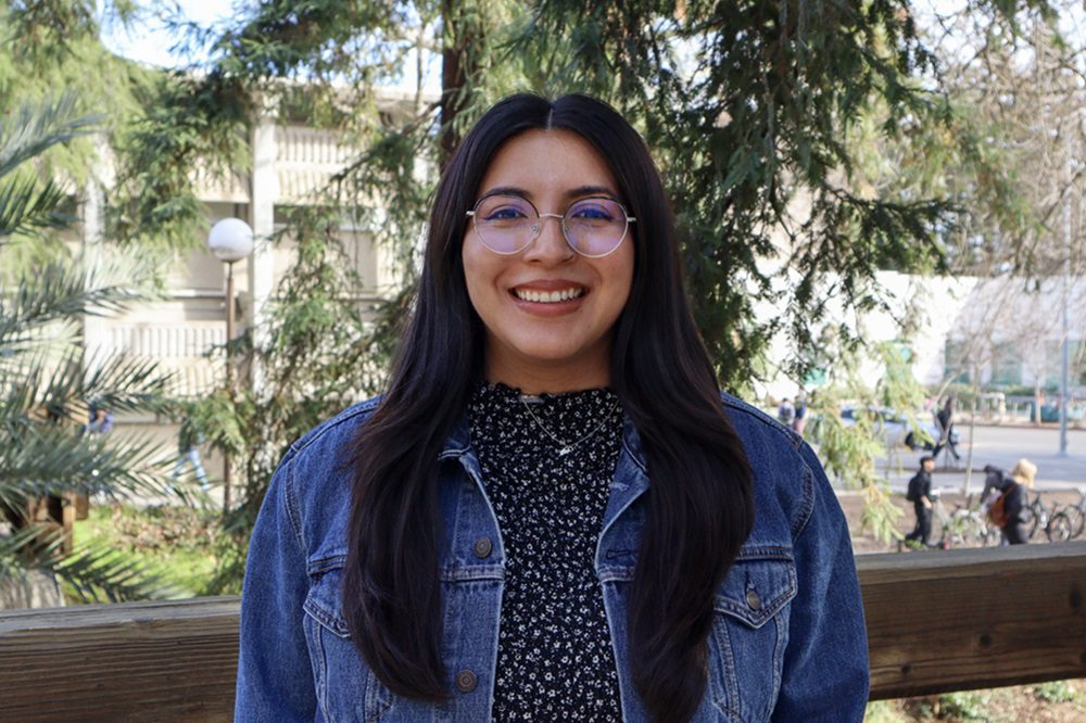 Portrait of Maria Cruz with trees in the background