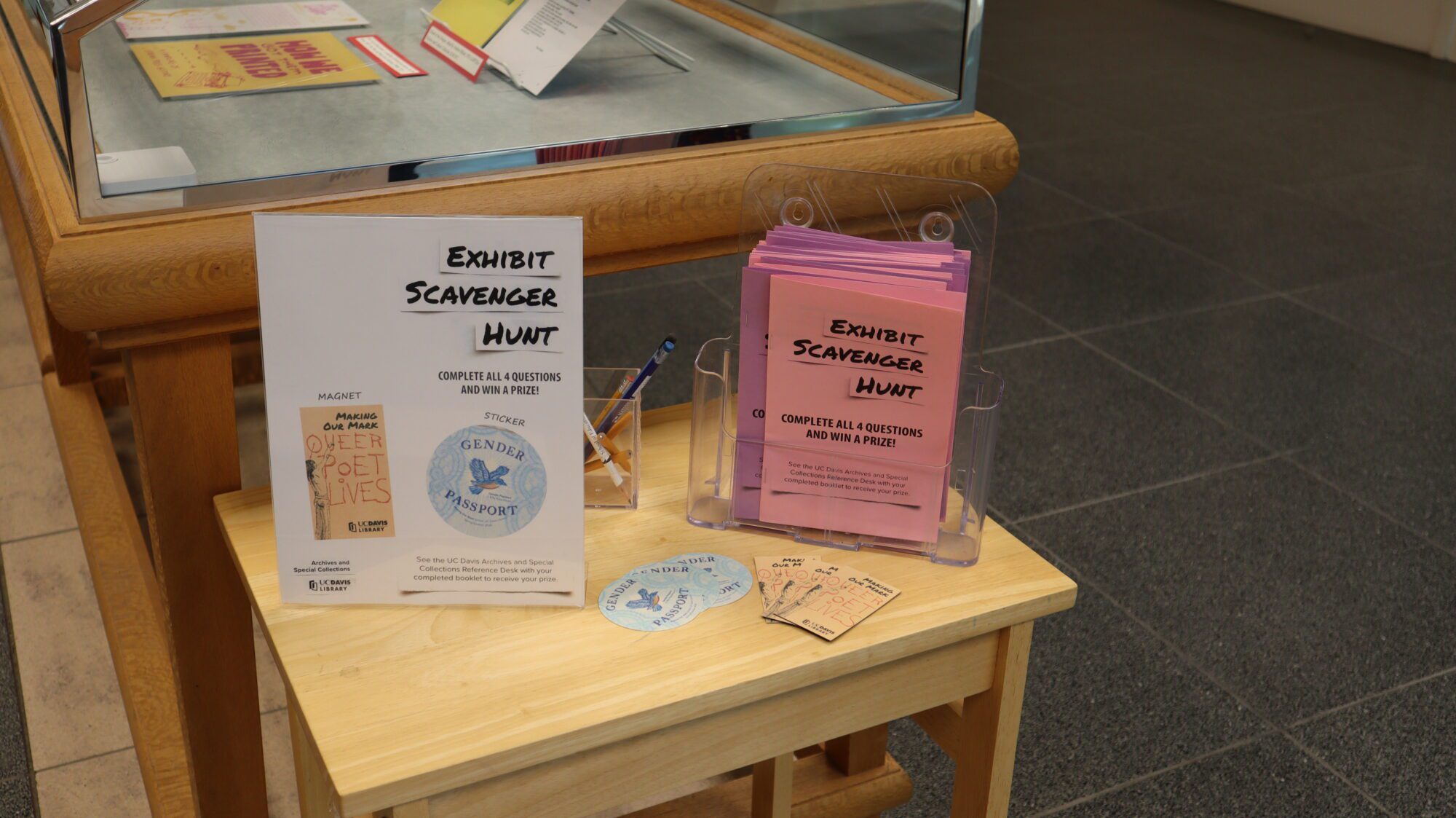A small table containing takeaway pamphlets and stickers.