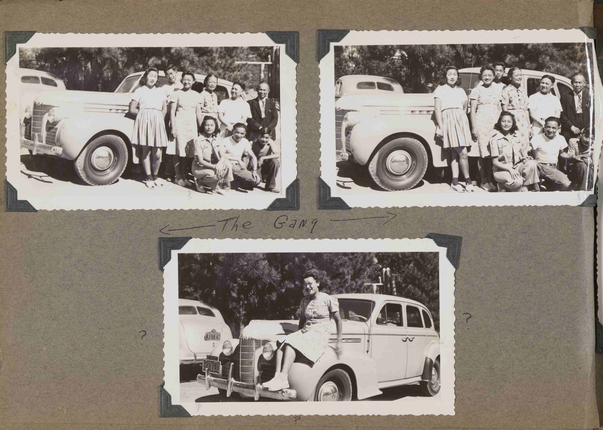 A scan of a page of a photograph album with three black and white photographs of people next to a car.