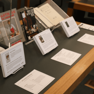 Recipe cards on display on a table with cookbooks displayed behind them